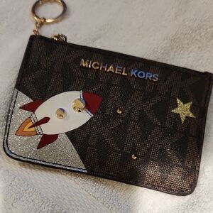 Michael Kors Black Wristlet with Rocket and Star Design